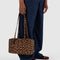 model holding brown leopard nylon bowler bag