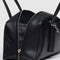 side view of medium black recycled dome bowler bag with silver charm clasp
