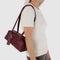 model carrying mahogany small dome recycled leather bowler bag with silver charm clasp