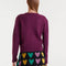 back view of model wearing fuzzy burgundy cardigan with colorful button front