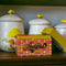 retro 70's print recipe box with gold foil 'RECIPES' across the front