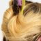 model wearing double sided hair claw: translucent brown with black dashes and lime green/yellow reverse side
