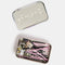 black and pink bobby pins and tin with dangling kitty charms