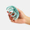 model holding blue swirl large octopus hair claw