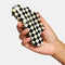 model holding black and white checkered large nimbus hair claw