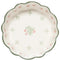top view of sage large bowl with scalloped top and dainty red floral print interior