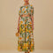 model wearing yellow and white mixed fruit tiered maxi skirt with tie waist and matching top