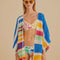 model wearing colorful stripe crochet kimono