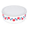 top view of glass storage bowl with white lid and red and blue flower design