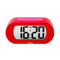 red digital alarm clock with pink trim