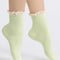 model wearing lime green waffle socks with cream lace trim