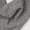 up close of grey knit triangle essential scarf