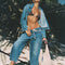 model wearing light indigo pull on jeans with elastic tie waist and patch front pockets