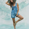 model wearing light denim pull on shortalls with zipper front
