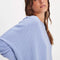 side view of model wearing periwinkle oversized thermal top