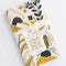 packaged white tea towel with goldenrod floral and bee print