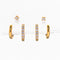 three pairs of gold essential earrings: gold hoops, crystal hoops and crystal studs