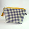 navy and cream gingham quilted pouch with yellow print trim