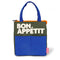 blue, green, and orange color block lunch bag with 'bon appetit' across the front