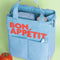 light blue color block lunch bag with 'bon appetit' across the front in red on a green ground