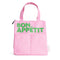light pink lunch bag with lime green 'bon appetit' across the front