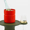 orange ice bucket with a bottle inside and wine glass next to it