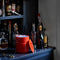orange ice bucket sitting on an at home bar