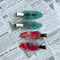 setting clips: 2 iridescent hot pink and 2 aquamarine