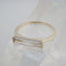 gold band ring with clear crystal baguette stone