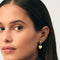 model wearing gold hoop earrings with detachable dainty heart charm