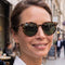model wearing tortoise round sunglasses with dark grey lenses