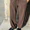 model wearing cotton chocolate brown balloon pants with side pockets