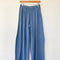 cornflower cotton wide leg pants with side inlets on a hanger