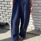 model wearing navy flowy pants