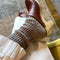 model wearing thick brown marled socks with clogs