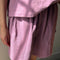 up close of model wearing dusty lilac cotton basketball shorts with matching tee