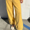 model wearing french terry deep yellow balloon pants with side pockets