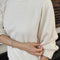 model wearing naturel relaxed fit raglan sweatshirt tunic