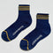 navy crew socks with three gold stripes at the top