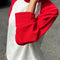 model wearing white relaxed fit raglan tee with red sleeves