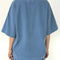back view of model wearing cornflower oversized tee with oversized sleeves