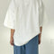 back view of model wearing white oversized tee with oversized sleeves