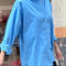 model wearing buttoned oversized lake blu button down top