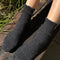 model wearing charcoal grey ribbed scalloped socks