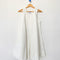 white denim mini dress on a wooden hanger