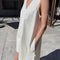 model wearing white denim mini dress