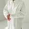 model wearing oversized cotton white button down top