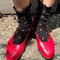 model wearing black ruffle socks with pink dainty flower print and red flats