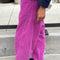 side view of model wearing lilac pink corduroy arc pants