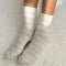 model wearing white socks with thin sky blue stripes